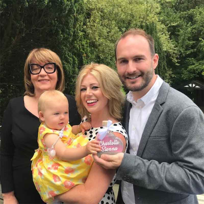 Jeanette with a happy mum, dad and baby